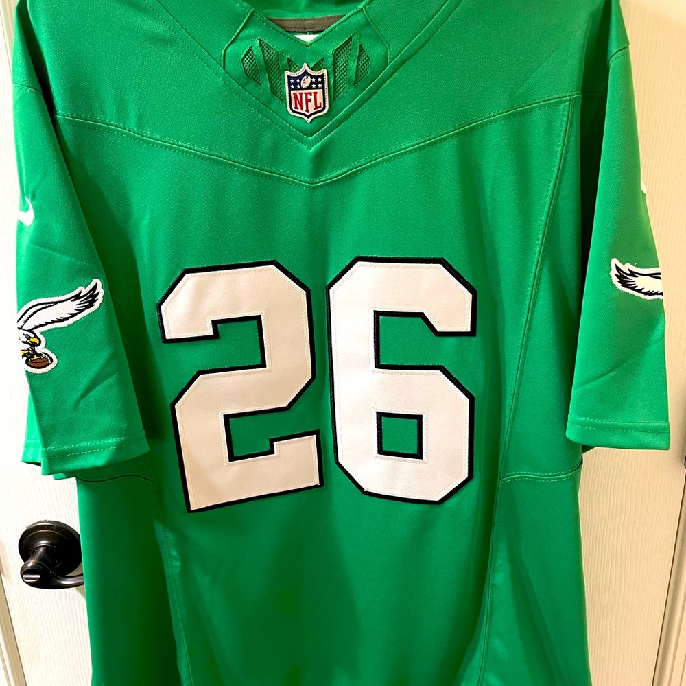 Brand new men’s size small eagles Kelly green Saquon Barkley jersey.